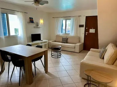 a living room with a couch and a table at Leme Bedje - By Bobbywashere in Santa Maria