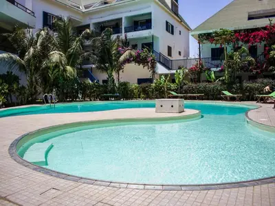 a large swimming pool in front of a building at Leme Bedje - By Bobbywashere in Santa Maria