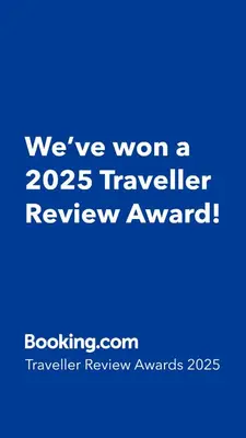 a blue sign that says weve won a traveler review award at Cubico Tota in Praia