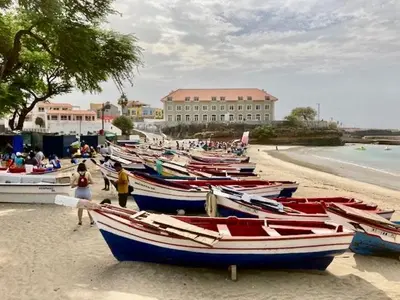 a group of boats sitting on the beach at Apartment with sea view near the beach and the village center! in Tarrafal