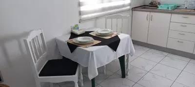a table in a kitchen with a black and white table at Ka-Bela 2 in Sal Rei