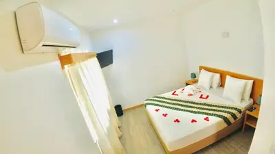 a small room with a bed in a room at Hotel São Jorge village in Órgãos