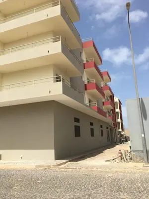 a tall building on the side of a street at Ca'Claudia Boavista in Sal Rei