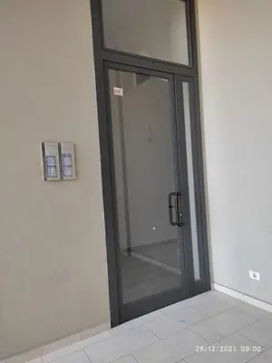 a glass door with a mirror on a wall at Ca'Claudia Boavista in Sal Rei