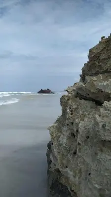 a rock on the beach with the ocean in the background at Ca'Claudia Boavista in Sal Rei