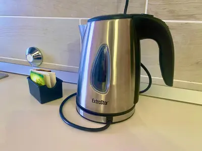 a silver and black electric kettle on a counter at Ca GIOgió in Santa Maria