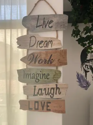 a sign that reads live dream worst imagine laugh love at Amilcar Cabral Loft in Praia