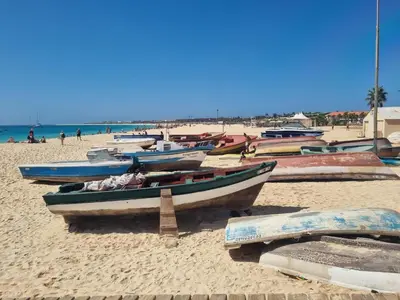 a bunch of boats sitting on a sandy beach at DAISAL APARTMENT - 2 bedroom apartment with balcony near the beach & city center in Santa Maria
