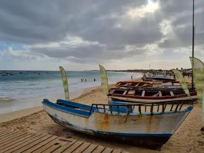 a group of boats sitting on the beach at DAISAL APARTMENT - 2 bedroom apartment with balcony near the beach & city center in Santa Maria