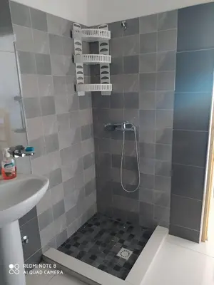 a bathroom with a shower and a sink at Guest House Maio in Vila do Maio
