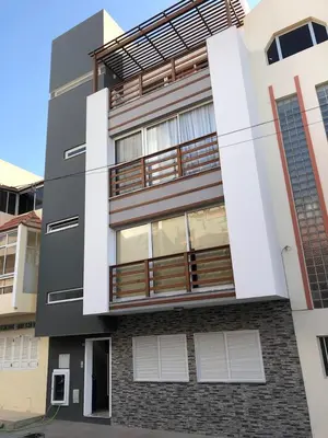 a black and white building with a balcony at Duarte Apartments - Laginha in Mindelo