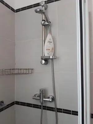 a shower with a hair dryer in a bathroom at App Raffaele Estoril Beach Free Wifi & AC a step away from the sea in Sal Rei