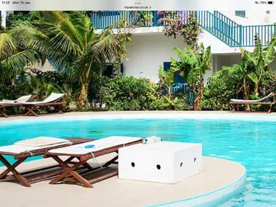 a swimming pool with two chaise lounges and a swimming pool at Leme Bedje GST84 3 bedroom apt with Panaramic views in Santa Maria