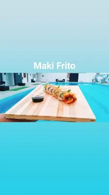 a cutting board with food on a table in a pool at Académico do Sal in Espargos