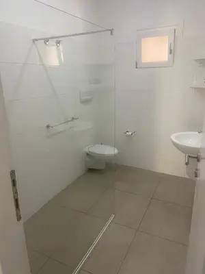 a bathroom with a toilet and a sink at Apt14 Porto Antigo 1 with Pool and Beach views in Santa Maria