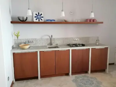 a kitchen with a sink and a counter at Villa Pescadora spectacular view, luxery fisherhouse design in Sal Rei