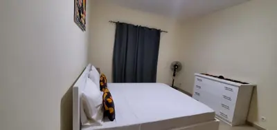 a small bedroom with a bed and a dresser at Apartamento Teixeira in Espargos