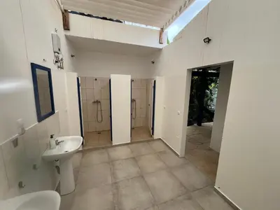 a bathroom with a sink and a toilet at Quintal do Maio in Vila do Maio