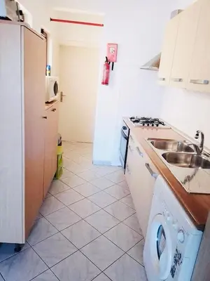 a kitchen with a sink and a stove at Vila Murdeira in Palha Verde