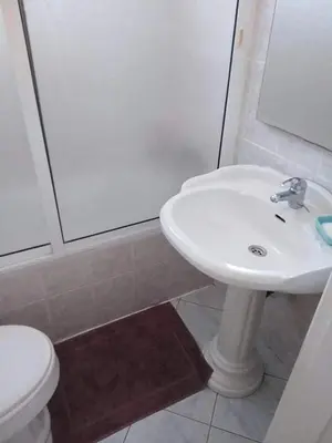 a bathroom with a sink and a shower and a toilet at Vila Murdeira in Palha Verde