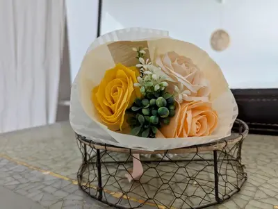 a plate with a bouquet of flowers on a table at Tropical Leaves Sea view penthouse ca Greta 2 floor in Sal Rei