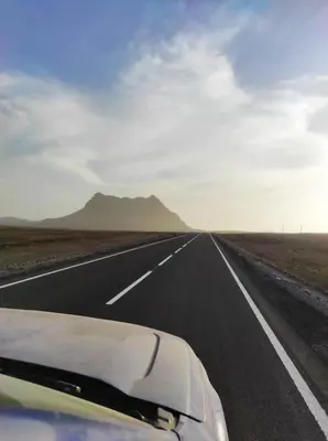 a car driving down a road in the desert at Tropical Leaves Sea view penthouse ca Greta 2 floor in Sal Rei