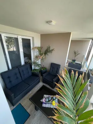 a living room with a couch and a table at Luxury Beachhouse Apartment Boa Vista in Sal Rei