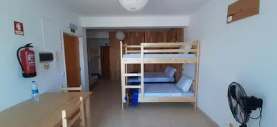 a room with two bunk beds in a room at Atlantic Sal Hostel in Santa Maria