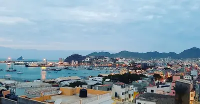 a view of a city with boats in the water at Apartamento Augusta Amwilla Guesthouse in Mindelo