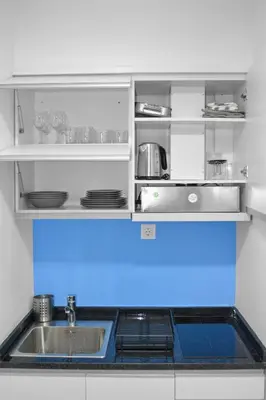 a kitchen with a sink and a counter top at AP2B Praia in Praia