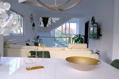 a living room with a couch and a table at VILLA NAYELI Luxury and Simplicity in Órgãos