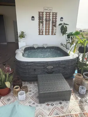 a large bath tub in a room with plants at VILLA NAYELI Luxury and Simplicity in Órgãos