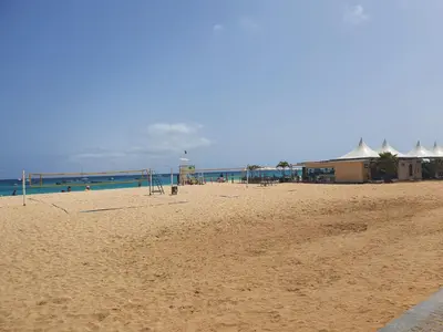 a sandy beach with a group of people on it at Appartement Amalia Sal Santa Maria in Prainha