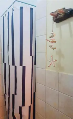a bathroom with a wall with a starfish andautical objects at Casa Carlotta - Authentic Stay in Maio in Vila do Maio