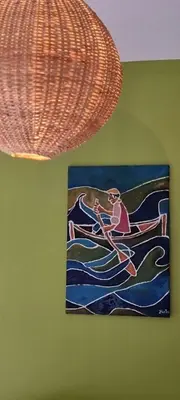 a painting of a person in a boat in the water at Kasa d'Vizin in Paul