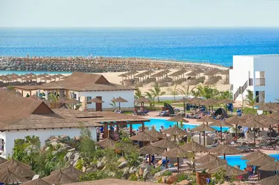 an aerial view of a resort with umbrellas and a beach at Melia Llana Beach Resort & Spa - Adults Only - All Inclusive in Santa Maria