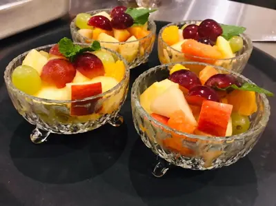 four bowls filled with fruit on a table at Hotel Château Georgette in Pombas