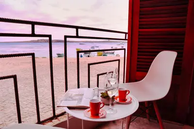 a table and chairs with a view of the beach at Leben am Atlantik hautnah spüren in Sal Rei