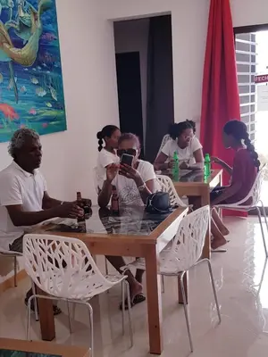 a group of people sitting at a table at Casa JPi in São Pedro