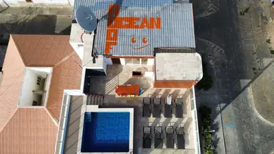 an overhead view of a building with a swimming pool at Ocean Roof in Santa Maria