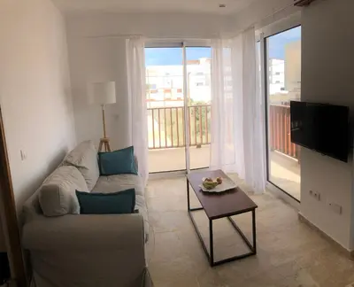 a living room with a couch and a table at Ocean Roof in Santa Maria