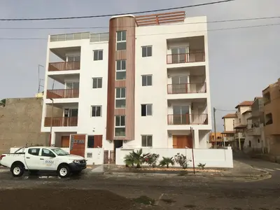 a white car parked in front of a building at Ocean Roof in Santa Maria