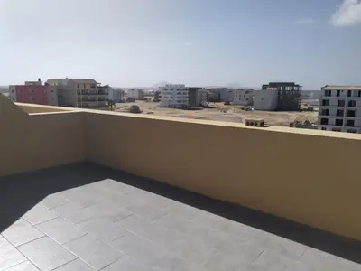 a balcony with a view of a city at Zodiaco Apartments in Sal Rei