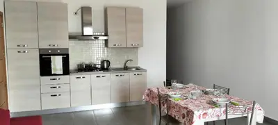 a kitchen with a table with a table cloth at Zodiaco Apartments in Sal Rei