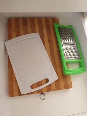 a green and white litter box on a wooden floor at Santa Maria Borgo Verde Apartment T2 in Santa Maria