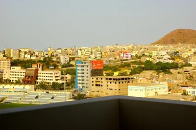a view of a city from a balcony at Hotel Praia Confort in Praia