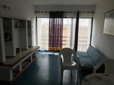 a living room with a couch and a chair at Beach Rotxa in Vila do Maio