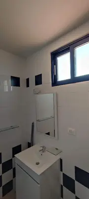 a bathroom with a sink and a mirror at Sal Service new studio penthouse in Santa Maria