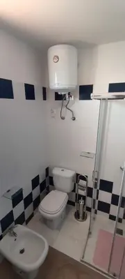 a bathroom with a toilet and a sink at Sal Service new studio penthouse in Santa Maria