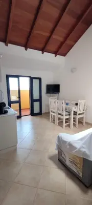 a large living room with a table and chairs at Sal Service new studio penthouse in Santa Maria